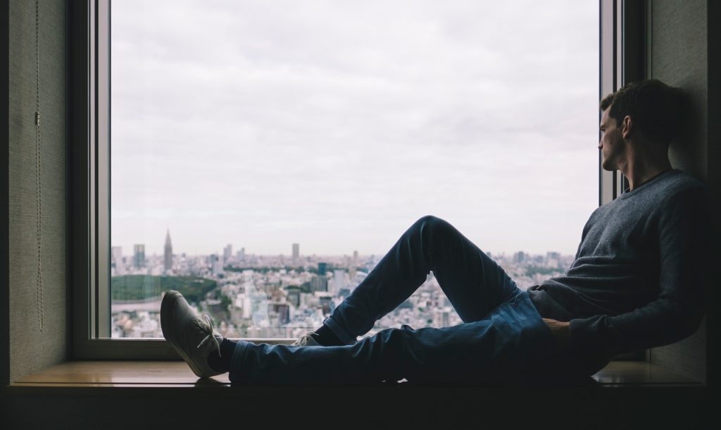 man sitting near the window