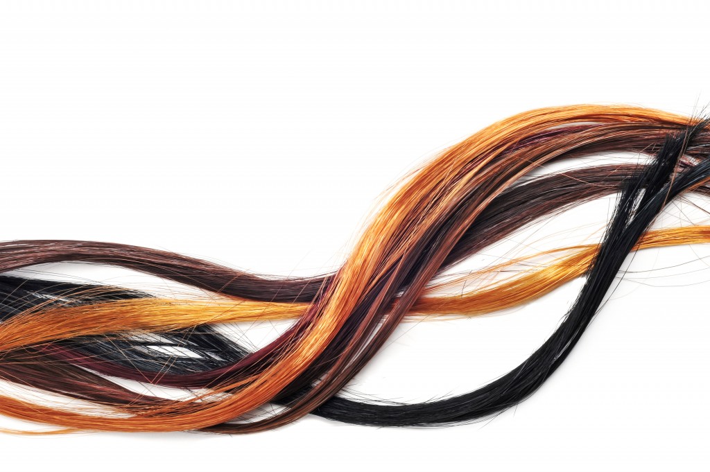 hair extensions of different colors on a white background