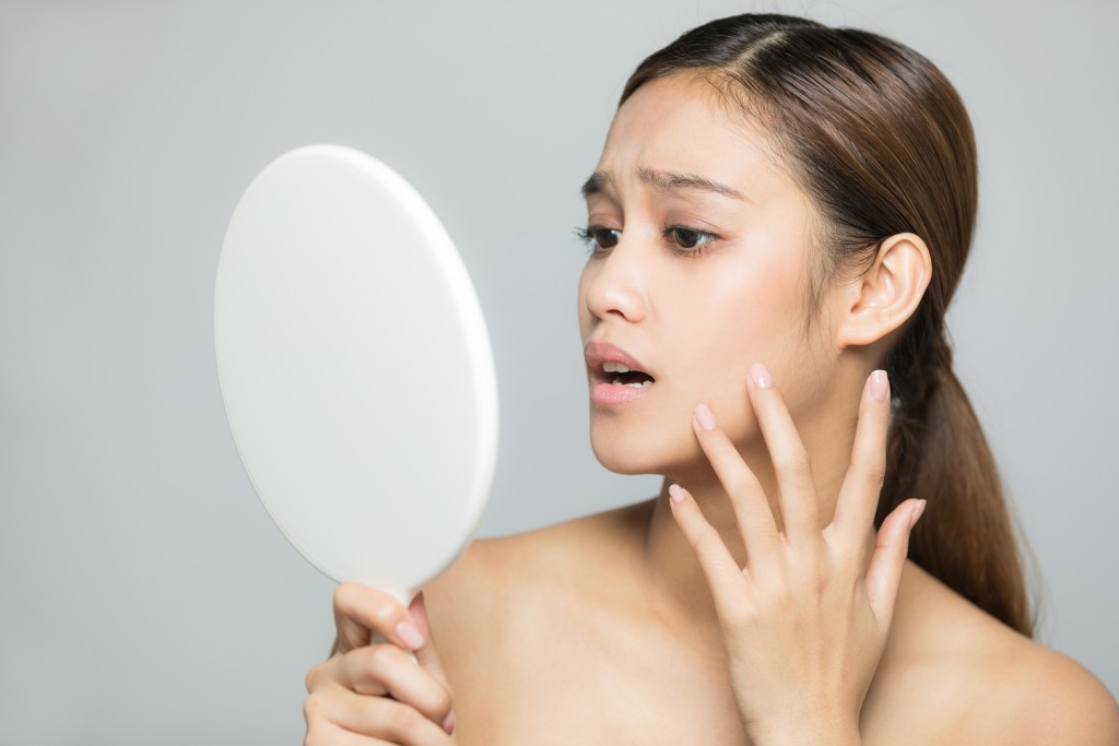 Woman having breakouts