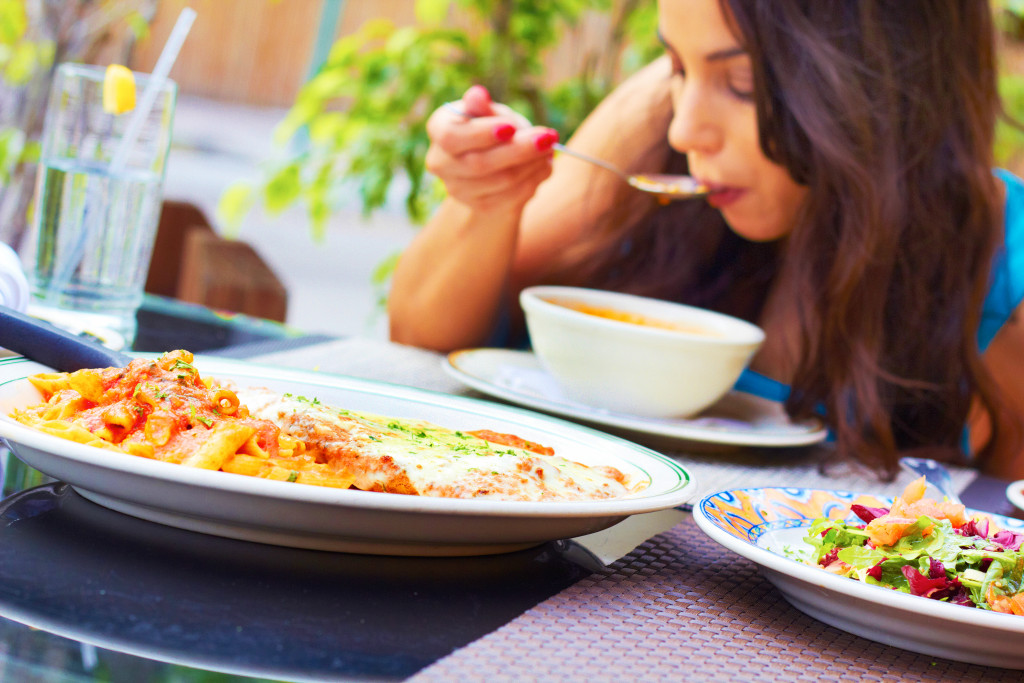 woman happily eating