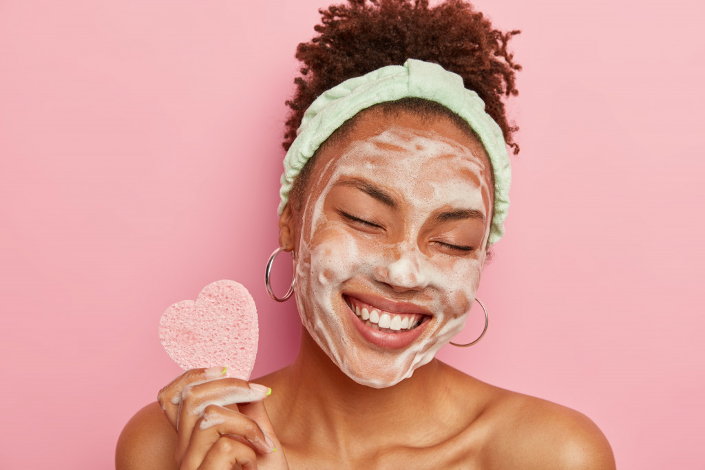 woman with cosmetic on her face