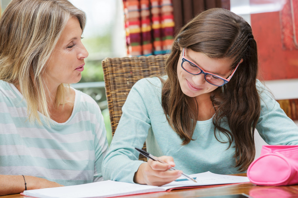 A mom helping her daughter study