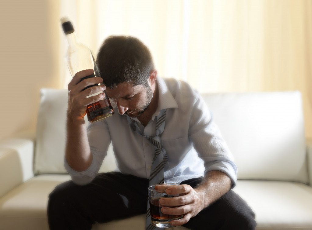 A man turning to alcohol due to depression