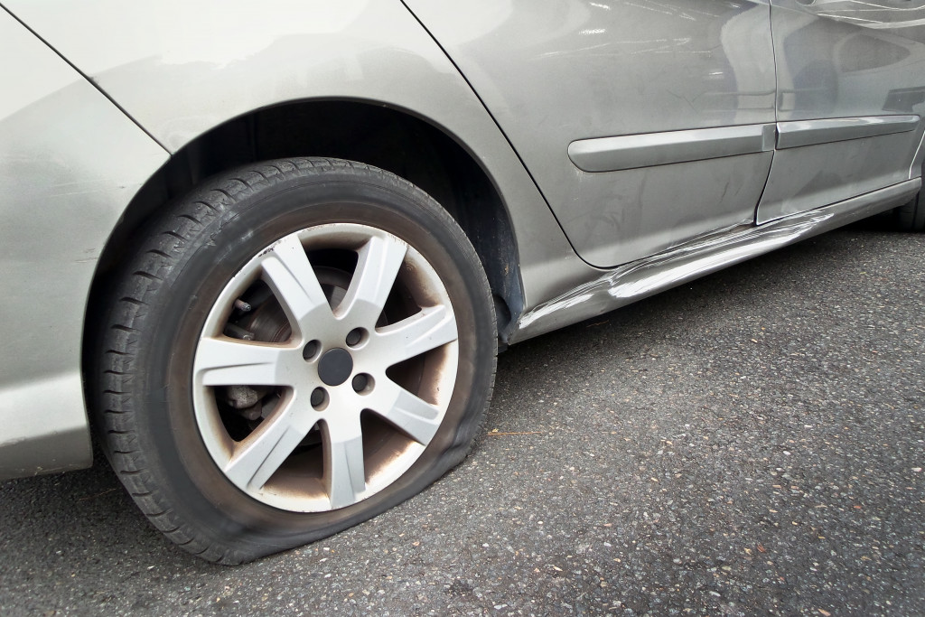 flat rear tire on silver or gray car