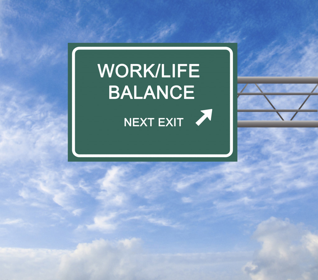 work life balance road sign against blue sky